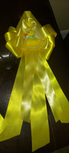 Yellow mom to be corsage